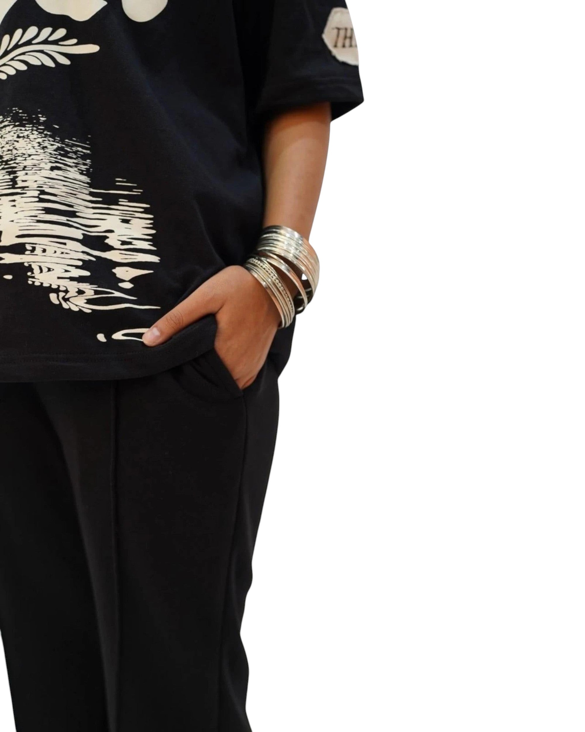 Thrive black pleated flared trousers in 250 gsm terry fabric with an elasticated waistband and raw hem edges.