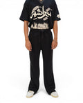 Thrive black pleated flared trousers in terry fabric with an elasticated drawstring waist and raw hem
