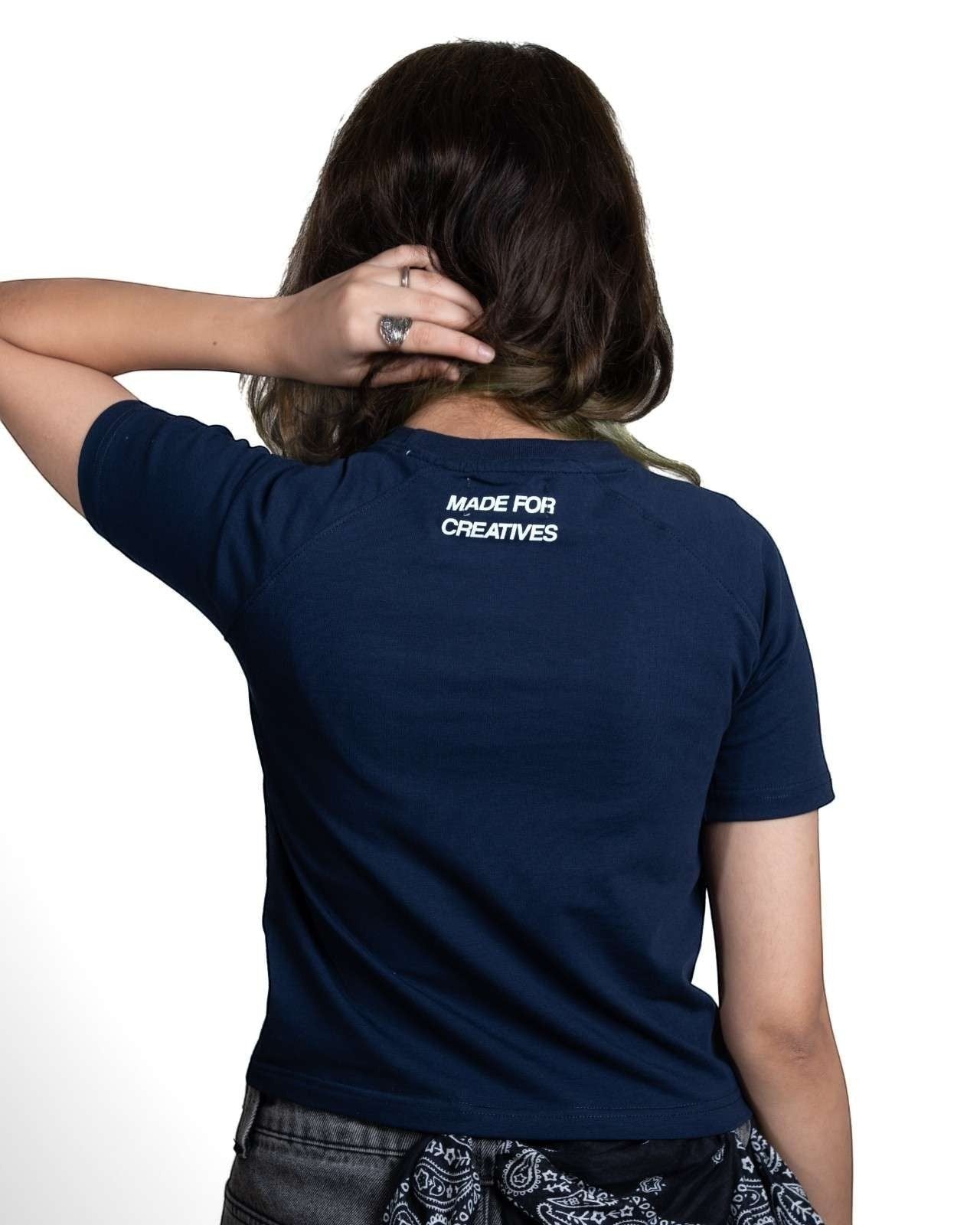 Thrive navy fitted raglan baby tee with Made For Creatives screen print on the back, worn by a woman