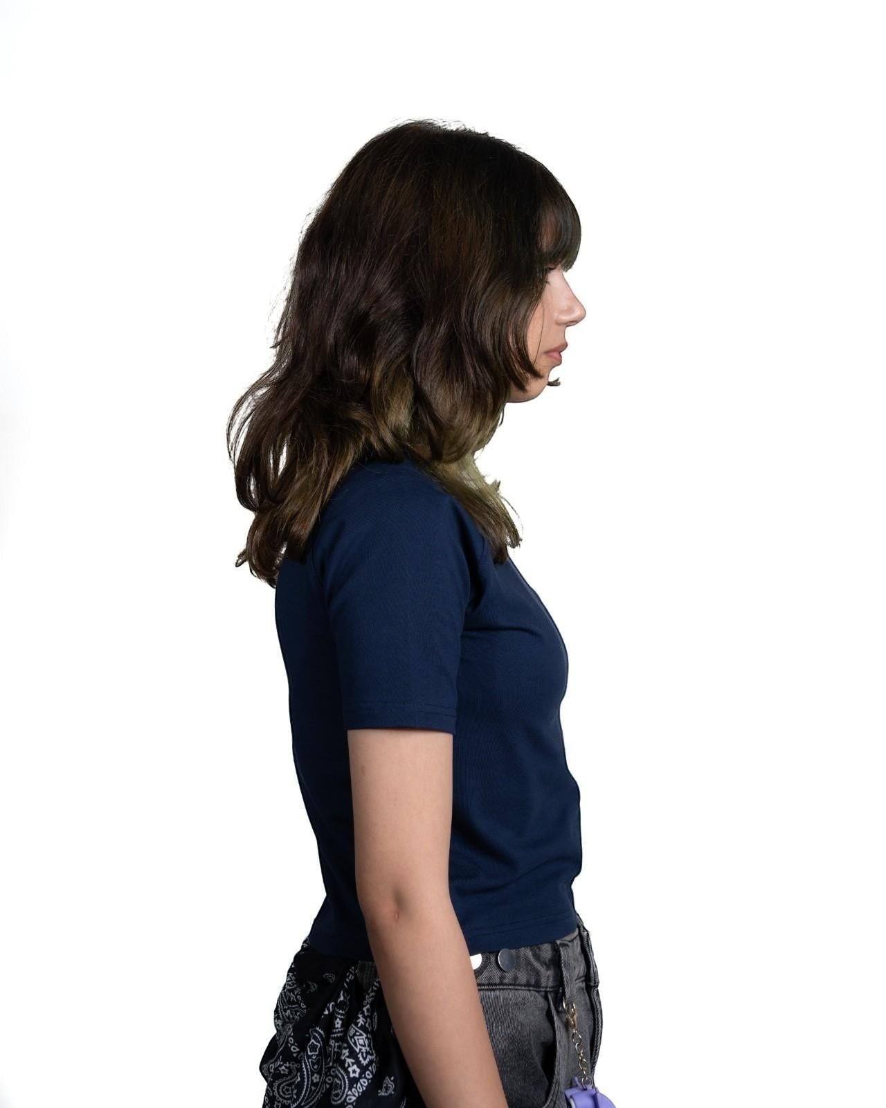 Thrive navy fitted raglan baby tee in cotton lycra jersey worn by a woman, side profile view.